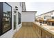 Exterior view of a back deck overlooking townhome-style residences with rear-entry garages at 4253 Millcroft Pl # 198, Buford, GA 30518