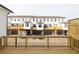 Backyard deck overlooking townhome-style residences and garages at 4253 Millcroft Pl # 198, Buford, GA 30518