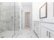 Bathroom features glass enclosed shower, double sink vanity, and tile flooring at 4253 Millcroft Pl # 198, Buford, GA 30518