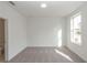 Bright bedroom with plush carpet and a large window fills the space with light at 4253 Millcroft Pl # 198, Buford, GA 30518