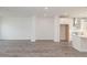 Open concept kitchen with modern stainless steel appliances flows into the living area at 4253 Millcroft Pl # 198, Buford, GA 30518