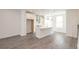 Bright kitchen featuring an island with stainless steel appliances and pendant lighting at 4253 Millcroft Pl # 198, Buford, GA 30518
