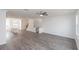 Inviting living area featuring hardwood flooring and seamless flow to the kitchen and stairs at 4253 Millcroft Pl # 198, Buford, GA 30518