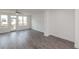 Bright living room showcases hardwood floors and an outdoor balcony for relaxing at 4253 Millcroft Pl # 198, Buford, GA 30518