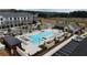 A refreshing community pool and lounging area with manicured landscaping, offering a relaxing outdoor retreat at 4253 Millcroft Pl # 198, Buford, GA 30518