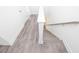 Staircase with hardwood steps, railing, and white trim adds a refined touch to the home at 4253 Millcroft Pl # 198, Buford, GA 30518