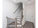 Staircase with wood and black iron railing adds a touch of modern elegance at 4253 Millcroft Pl # 198, Buford, GA 30518