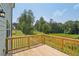 Beautiful back deck overlooks a green private backyard and wooded area at 7252 Eton Ln, Locust Grove, GA 30248