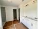 Bright bathroom featuring double sinks, a tiled shower, and modern fixtures at 7252 Eton Ln, Locust Grove, GA 30248
