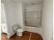 Bathroom with vanity, toilet, and bathtub with white tile surround at 7252 Eton Ln, Locust Grove, GA 30248