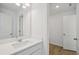 Bright bathroom featuring a white vanity, modern fixtures, and neutral color palette at 7252 Eton Ln, Locust Grove, GA 30248