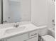 Clean bathroom featuring a single sink vanity and a shower-tub combo at 7252 Eton Ln, Locust Grove, GA 30248