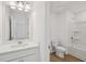 Well-lit bathroom featuring a vanity and separate shower-tub combo at 7252 Eton Ln, Locust Grove, GA 30248