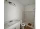 Clean, modern bathroom with new fixtures, white vanity, and a shower with built-in shelves at 7252 Eton Ln, Locust Grove, GA 30248