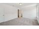 Bright bedroom with neutral carpet and ample natural light at 7252 Eton Ln, Locust Grove, GA 30248