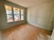 Bright bedroom with ample natural light streaming in from large windows at 7252 Eton Ln, Locust Grove, GA 30248