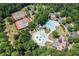 An aerial view of the community pool area with tennis courts and splash pad at 7252 Eton Ln, Locust Grove, GA 30248