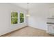 Cozy dining area with a view of the green backyard at 7252 Eton Ln, Locust Grove, GA 30248