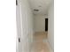 Bright hallway with white walls and door leading to other rooms at 7252 Eton Ln, Locust Grove, GA 30248