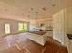 Spacious kitchen with white cabinets, granite countertops, and modern pendant lighting at 7252 Eton Ln, Locust Grove, GA 30248