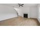 Open-concept living room with fireplace and wood-look flooring at 7252 Eton Ln, Locust Grove, GA 30248