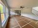 Open floorplan featuring living area with lots of natural light, staircase and kitchen at 7252 Eton Ln, Locust Grove, GA 30248