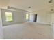 Main bedroom with a trey ceiling, natural light from two windows and neutral wall color at 7252 Eton Ln, Locust Grove, GA 30248