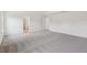 Spacious main bedroom with neutral carpet and large windows at 7252 Eton Ln, Locust Grove, GA 30248