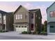 Modern two-story home featuring vertical siding, brick accents, and a two-car garage at 1994 Catnap Ct, Chamblee, GA 30341