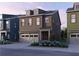 Exterior of a two-story home with neutral siding, a two car garage, and lovely landscaping at 1994 Catnap Ct, Chamblee, GA 30341