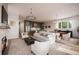 Bright and open-concept living space featuring a fireplace, dining area, and modern kitchen at 1920 Repose Dr, Chamblee, GA 30341
