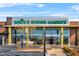 An appealing Whole Foods Market front entrance features plentiful windows and covered entrances for shoppers at 1994 Catnap Ct, Chamblee, GA 30341