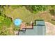 Overhead view of a pool, deck, and house displaying the backyard layout and outdoor living space at 4332 Brushy Mountain Rd, Rockmart, GA 30153