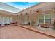Covered outdoor back porch with dual ceiling fans at 4332 Brushy Mountain Rd, Rockmart, GA 30153