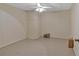Empty finished basement featuring paneled walls and neutral carpet, ready for customization at 4332 Brushy Mountain Rd, Rockmart, GA 30153