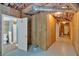Basement area with wood paneling and open doorway leading to a tiled bathroom at 4332 Brushy Mountain Rd, Rockmart, GA 30153