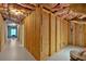 Unfinished basement area shows wood framing, insulation and utilities, ready for customization at 4332 Brushy Mountain Rd, Rockmart, GA 30153