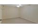 Spacious finished basement with paneled walls and neutral carpet, and a ceiling fan at 4332 Brushy Mountain Rd, Rockmart, GA 30153