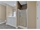 Bathroom featuring a walk-in tub, glass shower, and stone accent wall at 4332 Brushy Mountain Rd, Rockmart, GA 30153