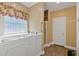 Bright bathroom featuring a modern walk-in tub and glass block window at 4332 Brushy Mountain Rd, Rockmart, GA 30153