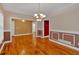 Dining room with hardwood flooring, decorative trim, and a view of the entranceway at 4332 Brushy Mountain Rd, Rockmart, GA 30153