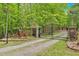 Gated driveway entrance with brick columns and an intricate wrought iron fence, offering security and curb appeal at 4332 Brushy Mountain Rd, Rockmart, GA 30153