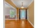 Entranceway with hardwood floors featuring a chandelier and decoratively trimmed walls at 4332 Brushy Mountain Rd, Rockmart, GA 30153