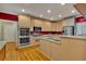 Modern kitchen with an island, stainless steel appliances, and plentiful storage at 4332 Brushy Mountain Rd, Rockmart, GA 30153