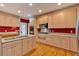Stylish kitchen with an island sink, stainless appliances, and ample cabinet space at 4332 Brushy Mountain Rd, Rockmart, GA 30153