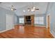 Spacious living room featuring a stone fireplace, hardwood floors, and vaulted ceilings at 4332 Brushy Mountain Rd, Rockmart, GA 30153