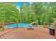Enjoy the outdoors with this pool with a wooden deck and slide, perfect for summer fun at 4332 Brushy Mountain Rd, Rockmart, GA 30153