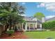 Spacious backyard with a stone patio, green lawn, and charming landscaping, perfect for outdoor enjoyment at 979 Bridgegate Ne Dr, Marietta, GA 30068