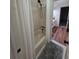 This bathroom features a shower with tile surround and a door leading into the adjacent room at 979 Bridgegate Ne Dr, Marietta, GA 30068