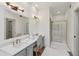 Bright bathroom with double vanity, large mirror, and separate shower at 979 Bridgegate Ne Dr, Marietta, GA 30068